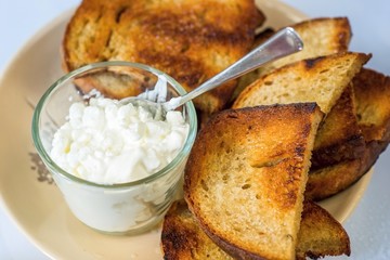 Cottage cheese and sliced fried bread.