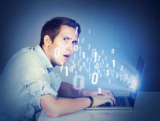 Surprised perplexed man with laptop learning computer science