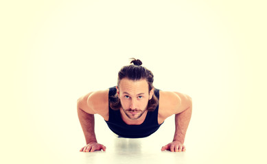 young man doing press-up