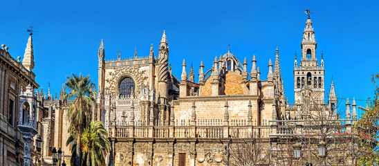 Beautiful Gothic building of the Cathedral of Saint Mary of the See (Seville Cathedral) on sunny...