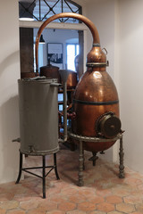Fototapeta na wymiar Ancient distiller for the production of perfume in Fragonard factory in Grasse, France