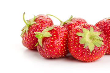 many berries ripe juicy strawberries on a white table