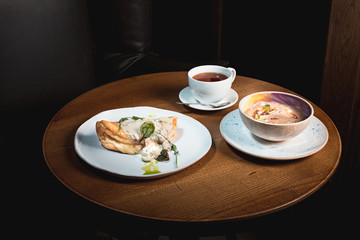 closeup of a plate with a typical tortilla de patatas, spanish omelet, on a set table