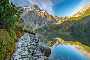 Fototapeta premium Tatra mountains, footpath and Morskie Oko lake, fall morning, Poland