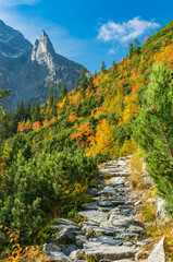 Tatra mountains, Mnich (Monk) peak over colorful autumn forest and footpath
