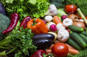 Fresh vegetables background close-up of tomatoes, cucumbers, onions, mushrooms
