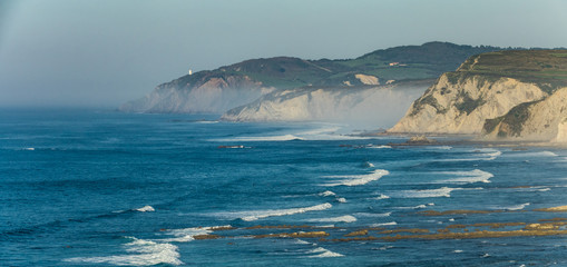 Sea mist over the coast cliffs in Sopelana