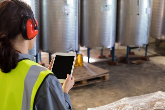 Female technician using digital tablet