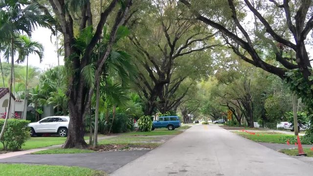 Coral Gables beautiful avenue. Miami attracts 15 million people annually.