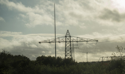 View of electricity poles next to the highway