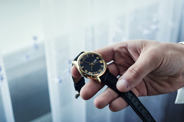 businessman clock clothes, businessman checking time on his wristwatch. men's hand with a watch,...
