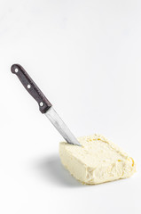 Knife in oil on a white background