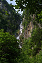 Waterfall dropping down into the Sounkyo gorge from the cliffs of Daisetsuzan National Park, Hokkaido, Japan