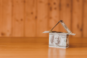 US dollar banknotes on display in the shape of a house on the expansion of the money