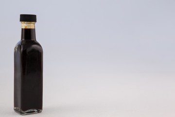 Oil bottle against wall