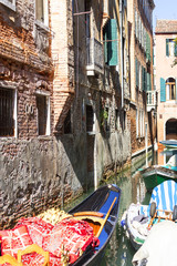 Typical view of the narrow side of the canal, with boats, Venice, Italy.