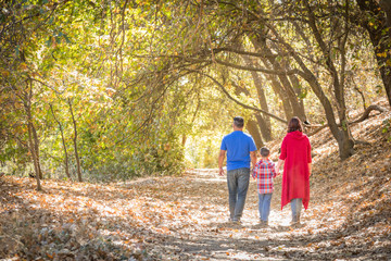 Fototapeta premium Mixed Race Caucasian and Hispanic Family Taking a Walk At The Park.