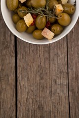 Overhead view of olives with cheese served in bowl