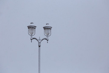 winter town with vintage classic lamp post.