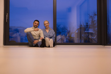 happy couple in front of fireplace