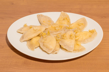 Dumplings with onion, quark and potato knows in Poland as Russian dumplings (Polish: Pierogi ruskie).