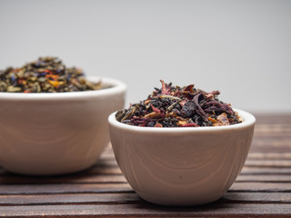 Tea of different kinds is poured into light cups.