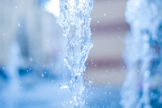 The gush of water of a fountain. Splash of water in the fountain, abstract image