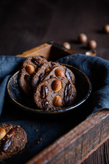 Chocolate chia seeds cookies topped with dried dates and macadamia nuts
