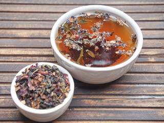 Tea of different kinds is poured into light cups.