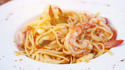 Spaghetti with spicy olive oil and seafood prawn