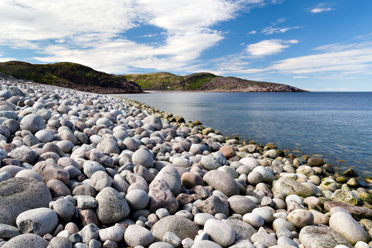 The rocky beach on the coast of the Barents Sea in the north of Russia