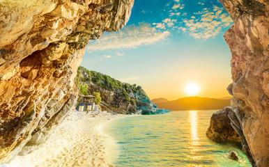 Beautiful sunrise reflected in the Ionian sea and the beach in Corfu, in the summertime, Europe - obrazy, fototapety, plakaty