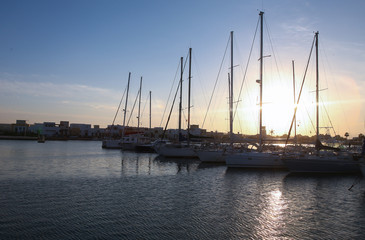 Fototapeta na wymiar Amazing sunset. Yachts in sunset