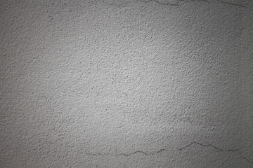 Gray wall surface, bright white in the middle. Backgrounds and Wallpapers