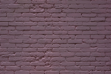Old painted brick wall with a pink tint - background, texture, copy-paste