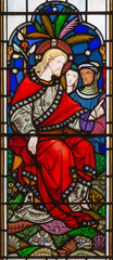 Fototapeta na wymiar LONDON, GREAT BRITAIN - SEPTEMBER 14, 2017: The teaching of Jesus on the stained glass in the church St. Michael Cornhill by Clayton and Bell from 19. cent.