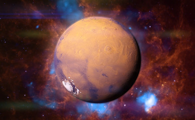 Obraz na płótnie Canvas planet Mars in front of a colourful nebula