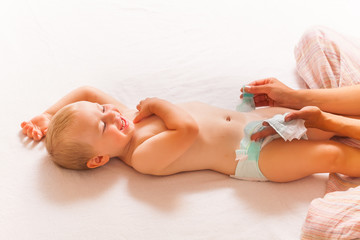 mom change baby diaper