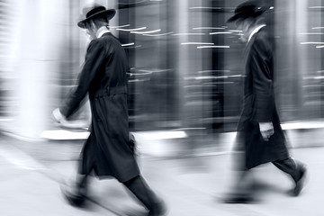 group of jewish business people in the street  in monochrome blue tonality