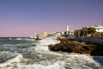 Shaky sea and rocks on the waterfront of Torre Canne