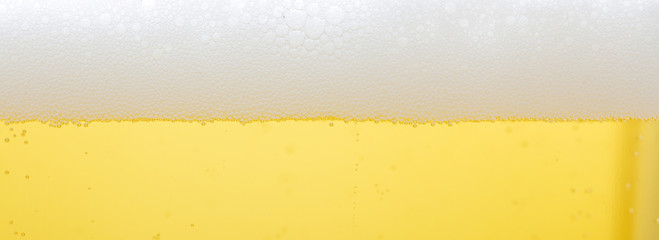 A glass of lager beer detail.