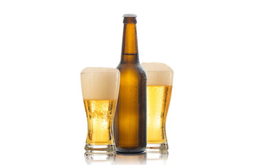 A bottle and two glasses of beer isolated on white background