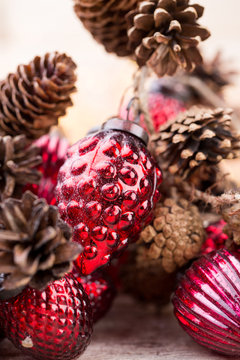 Christmas cone with red berries on a bokeh background.