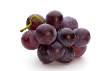 Ripe red grape isolated on white.