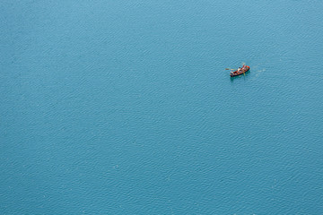 Fototapeta premium The boat sails on the lake. Aerial view