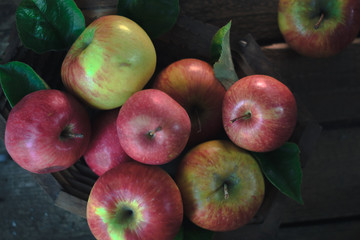 Fresh ripe apples on a wooden background. Autumn still life.