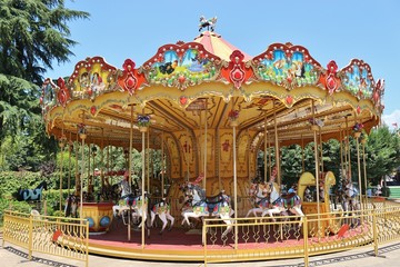Nostalgic children‘s carousel in a park in the center of Tirana, Albania. Southeast Europe.