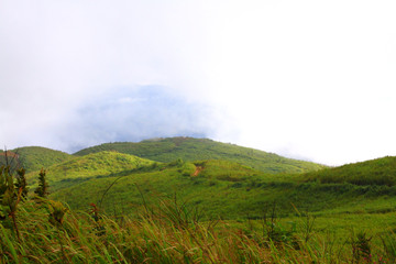 View at a mountain range with morning fog in a mountain valley