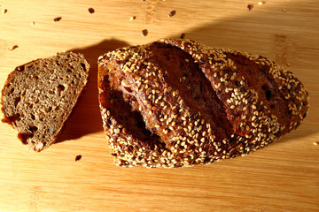 freshly baked multigrain bread on rustic background, top view