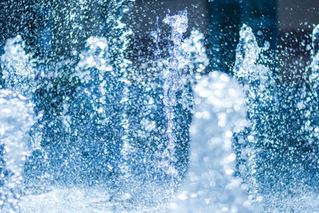 The gush of water of a fountain. Splash of water in the fountain, abstract image